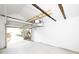Interior of a garage showing white walls and an open door at 415 Ruskin Pl, Indianapolis, IN 46205
