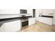 Well-lit kitchen with stainless steel oven, granite countertops, and ample storage space at 415 Ruskin Pl, Indianapolis, IN 46205
