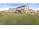 Large backyard with lush green grass and a gazebo with outdoor seating at 4179 Ironclad Dr, Bargersville, IN 46106