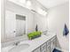 Bright bathroom with a double sink vanity, quartz counters, and a large mirror at 4179 Ironclad Dr, Bargersville, IN 46106