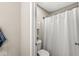 Clean bathroom featuring a shower and a toilet with simple and modern fixtures at 4179 Ironclad Dr, Bargersville, IN 46106