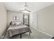 Comfortable bedroom featuring a ceiling fan, double-door closet, and carpeted floors at 4179 Ironclad Dr, Bargersville, IN 46106