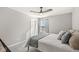 Cozy bedroom with a ceiling fan, plush bedding, and soft natural light at 4179 Ironclad Dr, Bargersville, IN 46106