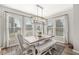 Inviting dining area filled with natural light, featuring a modern chandelier and stylish furnishings at 4179 Ironclad Dr, Bargersville, IN 46106