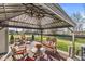 Cozy gazebo with comfortable seating, a round table and an outdoor grill area at 4179 Ironclad Dr, Bargersville, IN 46106