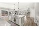 Bright, open kitchen with a large center island, stainless steel appliances, and hardwood floors at 4179 Ironclad Dr, Bargersville, IN 46106