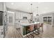 Stylish kitchen with white cabinets, an island with seating, and stainless steel appliances at 4179 Ironclad Dr, Bargersville, IN 46106