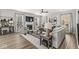 Comfortable living room features wood floors, neutral walls, fireplace, and ample seating at 4179 Ironclad Dr, Bargersville, IN 46106
