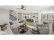 Spacious open-concept living room with wood floors that connects to the kitchen and dining area at 4179 Ironclad Dr, Bargersville, IN 46106