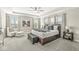 Spacious main bedroom features a tray ceiling, a large window and stylish furniture at 4179 Ironclad Dr, Bargersville, IN 46106
