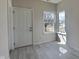 Entryway featuring tile floors and a window that lets in natural light at 5467 Powder River Ct, Indianapolis, IN 46221