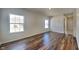 Bright living room with hardwood floors and multiple windows providing ample natural light at 5467 Powder River Ct, Indianapolis, IN 46221
