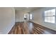 Cozy living space with hardwood floors, neutral walls, and convenient access to other rooms at 5467 Powder River Ct, Indianapolis, IN 46221
