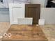 Showcasing samples of interior finishes, including floor tiles, cabinet colors, and countertop materials at 5715 Cloister Ln, McCordsville, IN 46055