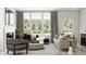 Inviting living room with comfortable seating, large windows, and natural light, creating a relaxing space at 5715 Cloister Ln, McCordsville, IN 46055