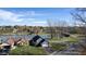 Aerial view of a well-maintained home with a lake view, lush lawn, and mature trees at 5901 Crystal Bay West Dr, Plainfield, IN 46168