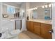 Bright bathroom with walk in tub, dual vanity, tile floor, and large window at 5901 Crystal Bay West Dr, Plainfield, IN 46168