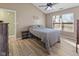 Cozy bedroom with natural lighting, comfortable furnishings, and neutral paint at 5901 Crystal Bay West Dr, Plainfield, IN 46168