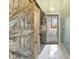 Welcoming entryway with rustic barn door accent, white tile flooring, and natural light at 5901 Crystal Bay West Dr, Plainfield, IN 46168