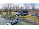 Lake house with a private boat dock and a patio perfect for outdoor enjoyment at 5901 Crystal Bay West Dr, Plainfield, IN 46168