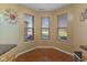 Bright kitchen nook with bay windows and hardwood floors perfect for casual dining at 5901 Crystal Bay West Dr, Plainfield, IN 46168