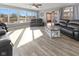 Comfortable living room with ample seating, great natural light, and hardwood style flooring at 5901 Crystal Bay West Dr, Plainfield, IN 46168