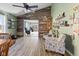 Inviting living room featuring a wood accent wall, light hardwood floors and lots of natural light at 5901 Crystal Bay West Dr, Plainfield, IN 46168