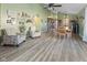 Spacious living room with vaulted ceiling, light hardwood floors and cozy seating area at 5901 Crystal Bay West Dr, Plainfield, IN 46168