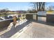 Outdoor kitchen area with built-in grill, countertop seating, and beautiful waterfront view at 5901 Crystal Bay West Dr, Plainfield, IN 46168