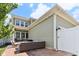 Exterior of home featuring a patio, green siding, and lush lawn at 5944 Aldridge Dr, Whitestown, IN 46075