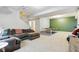 Spacious finished basement with sectional couch and a ping pong table for entertaining at 5944 Aldridge Dr, Whitestown, IN 46075