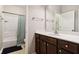 Clean bathroom featuring a vanity with dark wood cabinets, a sink, and a shower-tub combo at 5944 Aldridge Dr, Whitestown, IN 46075