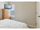 Bedroom featuring a television, chest of drawers, and a view to the outdoors at 5944 Aldridge Dr, Whitestown, IN 46075