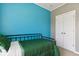 Bedroom with blue accent wall, twin bed, and carpeted floors at 5944 Aldridge Dr, Whitestown, IN 46075