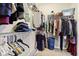 A functional walk-in closet features built-in shelving and racks for organizing clothes and shoes at 5944 Aldridge Dr, Whitestown, IN 46075