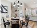 Well-lit dining room featuring a round table, six chairs, and stylish light fixture at 5944 Aldridge Dr, Whitestown, IN 46075