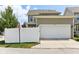 Charming home featuring an attached two-car garage and a well-maintained, enclosed yard with a white fence at 5944 Aldridge Dr, Whitestown, IN 46075