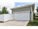 Home with a two-car garage and white fence at 5944 Aldridge Dr, Whitestown, IN 46075