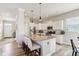 Modern kitchen island featuring granite countertops, pendant lights, and stainless steel appliances at 5944 Aldridge Dr, Whitestown, IN 46075