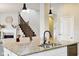 Modern kitchen featuring a large island with granite countertops, stainless steel appliances, and stylish pendant lighting at 5944 Aldridge Dr, Whitestown, IN 46075