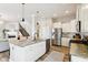 Spacious kitchen featuring a large center island, stainless steel appliances, and an open layout leading to living area at 5944 Aldridge Dr, Whitestown, IN 46075