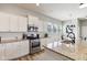 Well-lit kitchen with stainless steel appliances, white cabinetry, granite countertops, and a large island for cooking at 5944 Aldridge Dr, Whitestown, IN 46075