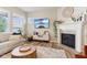 Inviting living room featuring a fireplace, large television, and modern decor at 5944 Aldridge Dr, Whitestown, IN 46075