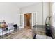 Home office with wood floors, a desk, a chair, and French doors leading into the hall at 5944 Aldridge Dr, Whitestown, IN 46075