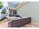 Exterior of home featuring a patio with outdoor furniture and green siding at 5944 Aldridge Dr, Whitestown, IN 46075