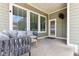 Inviting covered porch with comfortable seating, perfect for relaxing at 5944 Aldridge Dr, Whitestown, IN 46075