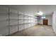 Basement utility room with wire shelving for ample storage at 6040 W Thompson Rd, Indianapolis, IN 46221