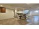 Finished basement area with neutral plank flooring and bar area, great for entertaining at 6040 W Thompson Rd, Indianapolis, IN 46221
