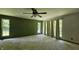Spacious bedroom featuring neutral carpet, large windows and ceiling fan for a comfortable, bright atmosphere at 6040 W Thompson Rd, Indianapolis, IN 46221