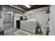 Basement laundry room including newer washer, dryer, and water filtration system at 6040 W Thompson Rd, Indianapolis, IN 46221